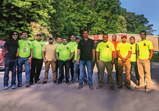 Owner Candido Hernandez (center, black shirt) and the GA Fire Proofing, LLC team.